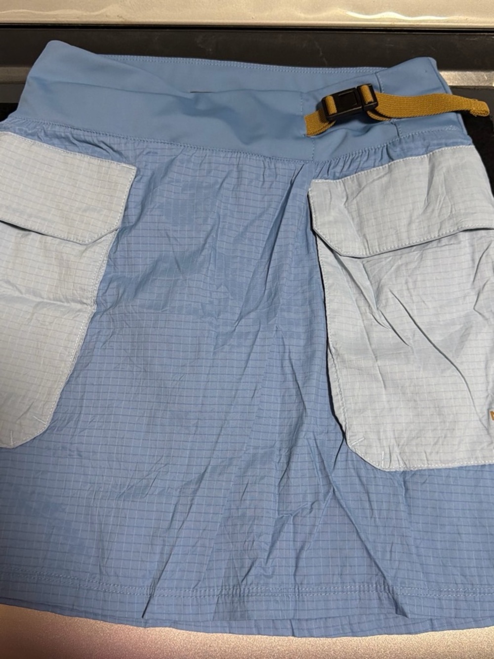 The North Face Light Blue Mini Skirt with Tan Webbing Belt